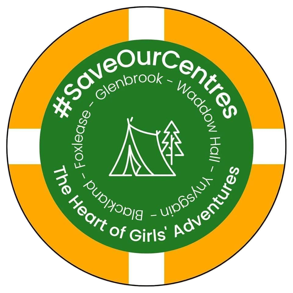 An orange and white life ring encircling a green field. In the centre of the field is a tent and a tree. Ringing the tent are the placenames Foxlease, Glenbrook, Waddow Hall, Ynysgain, Blackland. Between the placenames and the life ring are #SaveOurCentres and the words 'The Heart of Girls' Adventures'